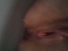 My friend's wife didn't mind showing off her hairless twat in the bathtub.